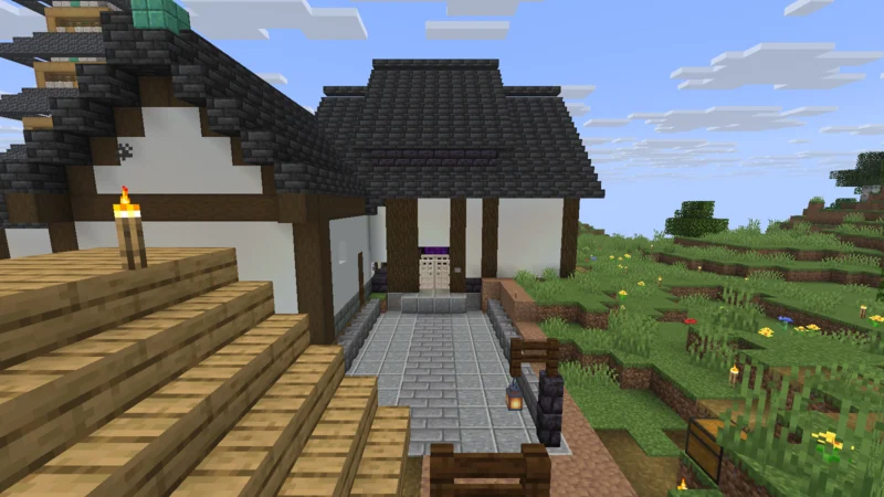 Approaching the Black Gate, a Japanese-style border gate built around the Nether portal