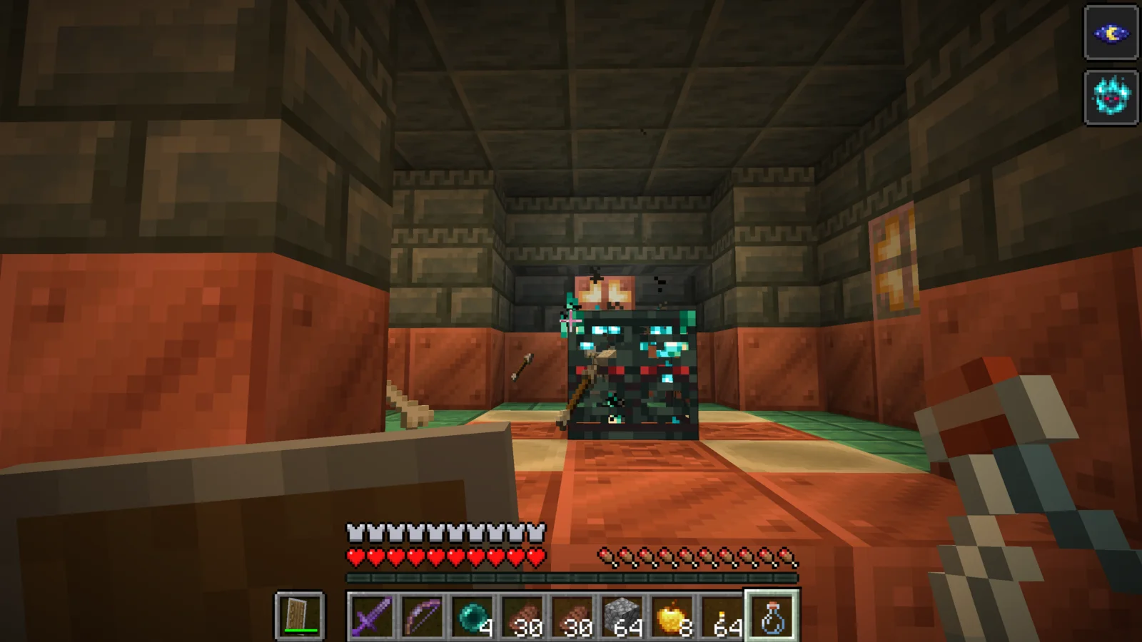 An Ominous Trial Spawner glowing with pale cyan flames