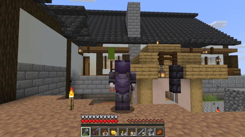 The suited man and a villager outside the white-walled timber residence