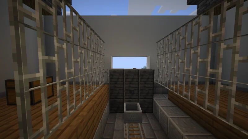A minecart waiting at the castle-town village station for the trip to the XP farm