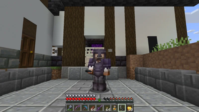 The suited man in full Netherite armor returning to the Black Gate