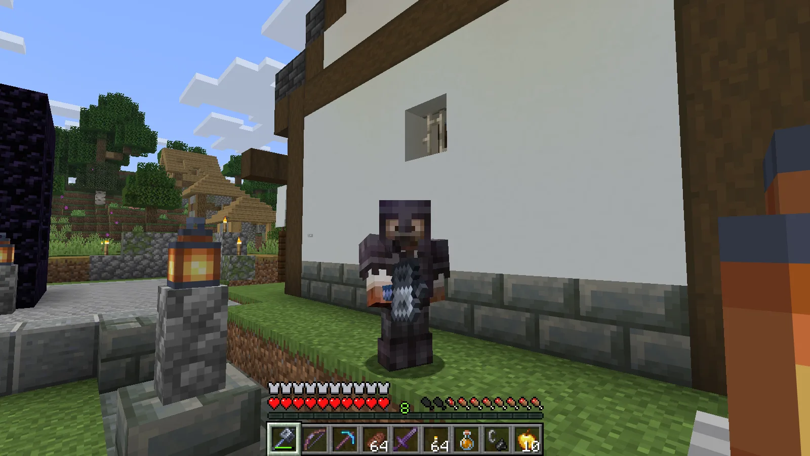 The suited man back in the village reflecting on the adventure with the Mace in hand