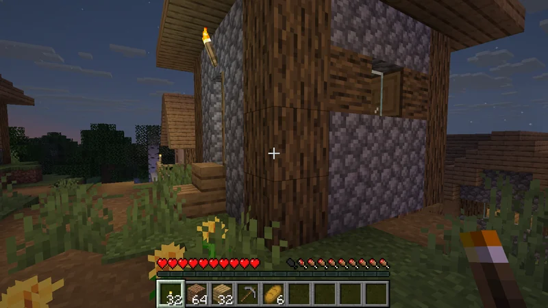 Torchlight around the village homes at night