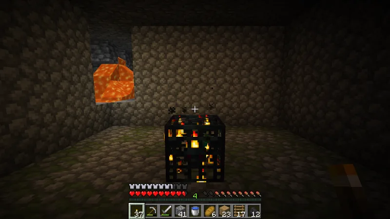 Finding a second zombie spawner in a dark room with lava visible in the wall Finding a second zombie spawner in a dark room with lava visible in the wall