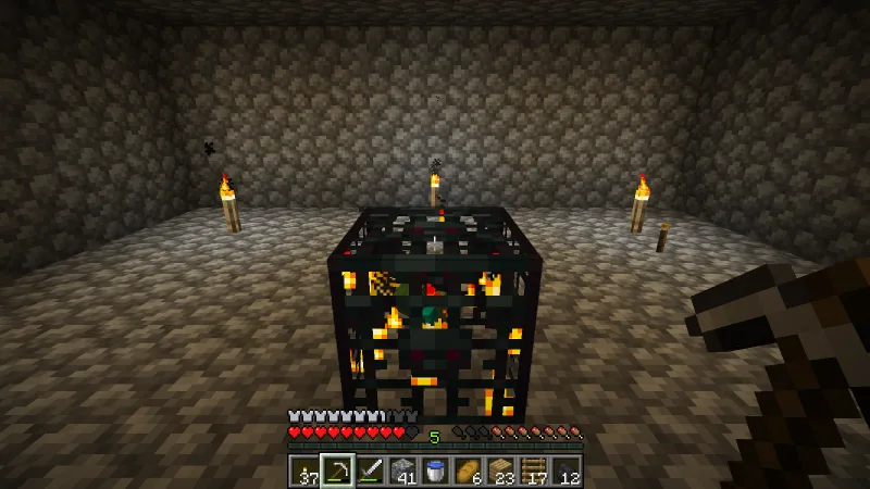 Digging out the area around the zombie spawner to prepare the spawning room Digging out the area around the zombie spawner to prepare the spawning room