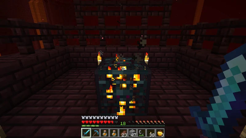 A Blaze spawner with a small rotating Blaze inside its dark cage A Blaze spawner with a small rotating Blaze inside its dark cage