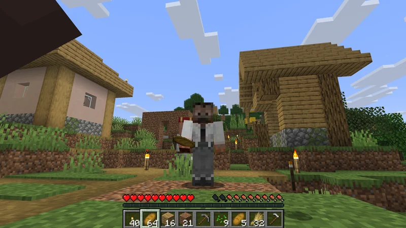 Standing among the villagers while holding bread