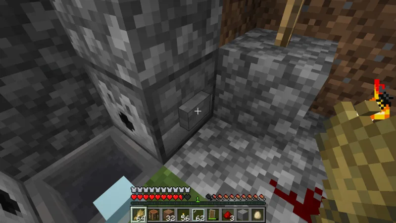 The button and redstone wiring connected to the dispenser that releases lava The button and redstone wiring connected to the dispenser that releases lava