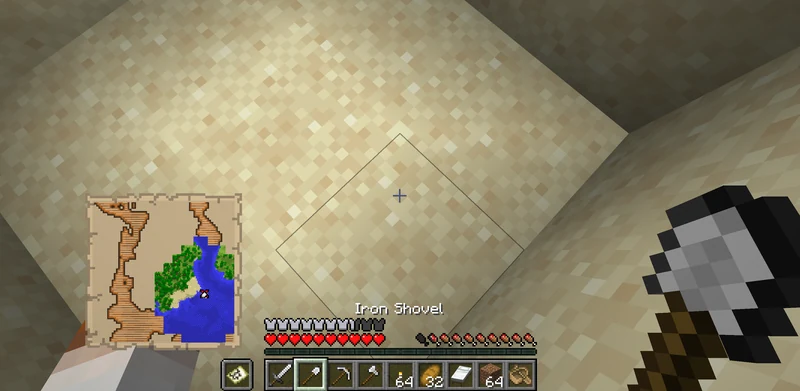 Digging through sand near the red X on the treasure map