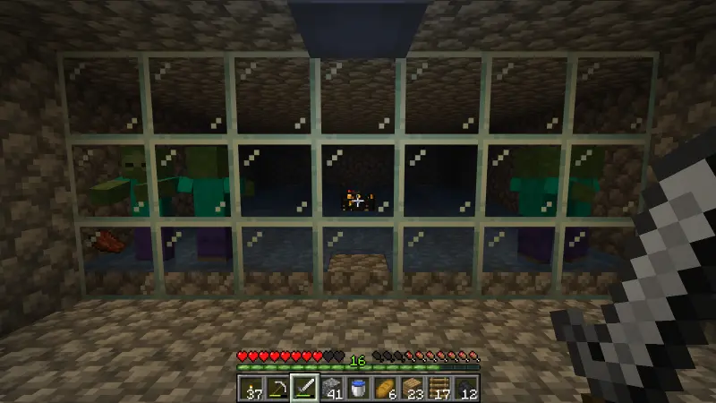 Zombie spawner, water channels, and several gathered zombies seen through glass Zombie spawner, water channels, and several gathered zombies seen through glass