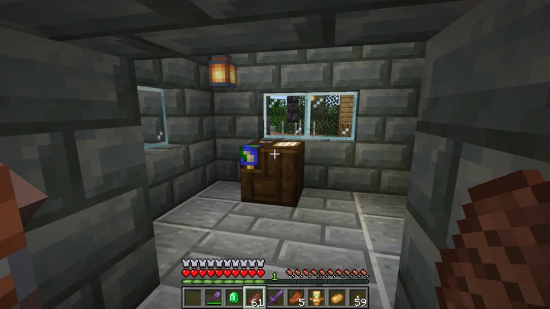 The workshop interior with a cartography table and hanging lanterns