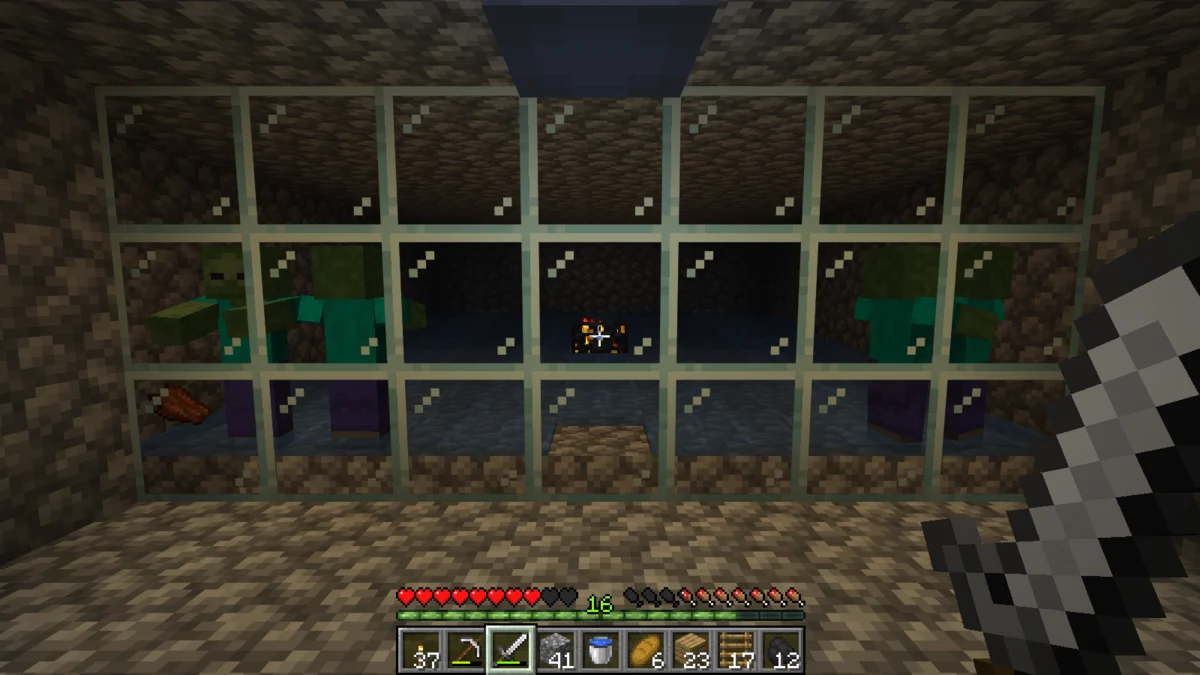 A zombie spawner XP farm running behind glass in our underground base
