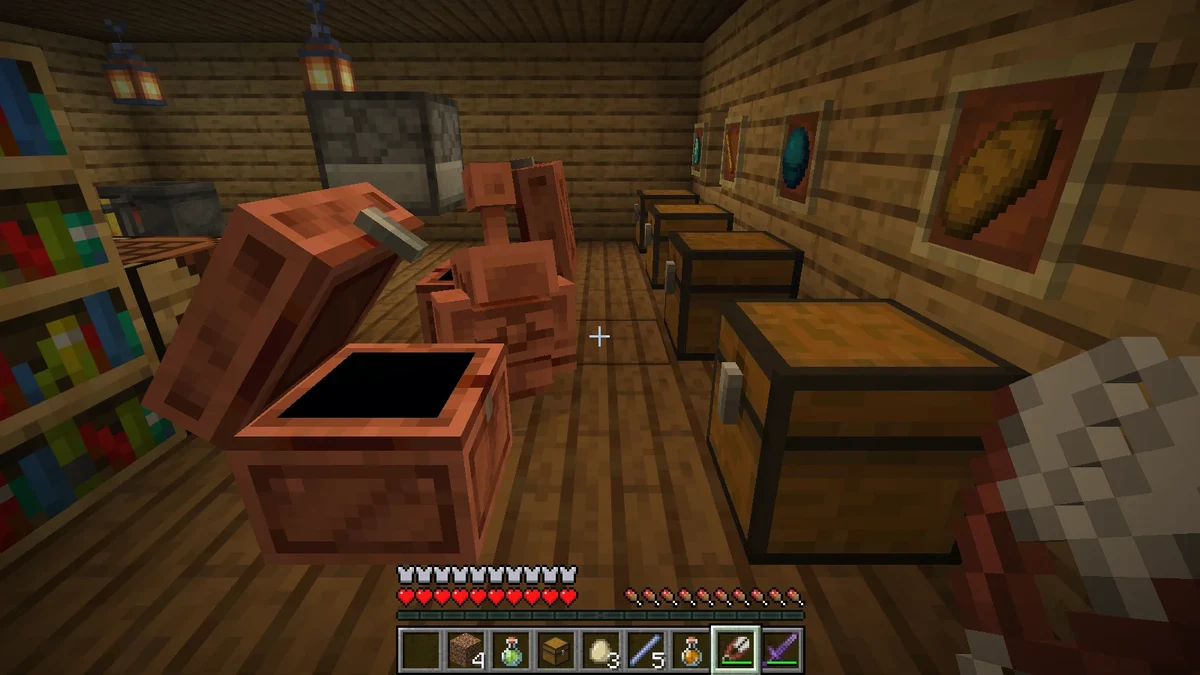 A Copper Golem standing in front of an open Copper Chest