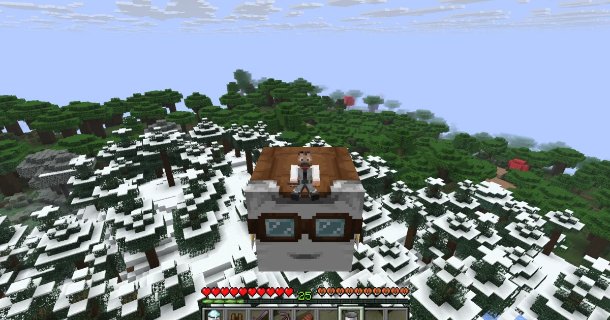 A snowy mountain and forest seen from a Happy Ghast above