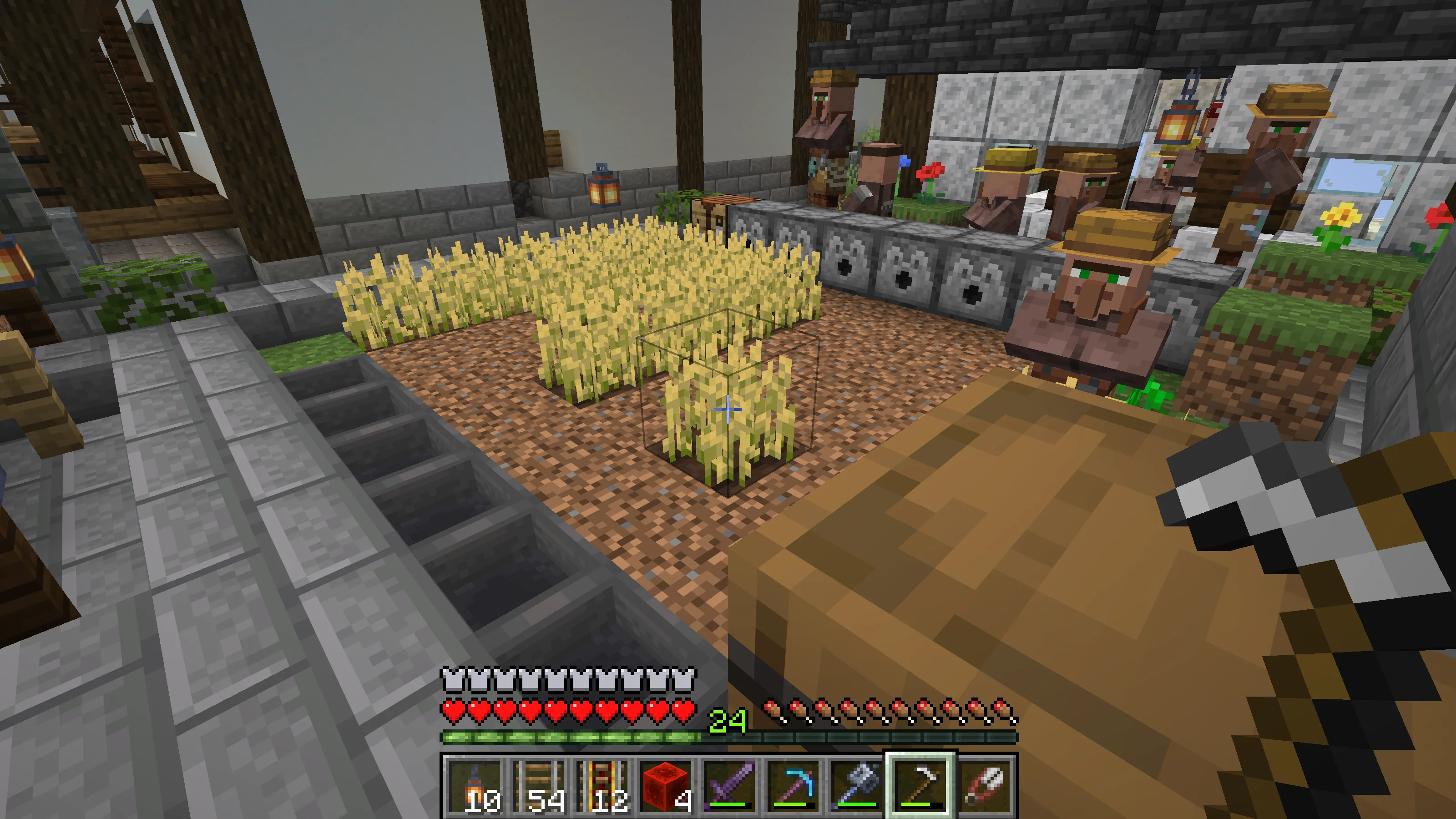 A farmer villager working beside ripe wheat A farmer villager working beside ripe wheat
