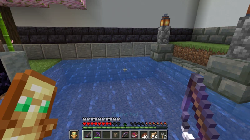Holding an enchanted fishing rod while facing the castle town pond Holding an enchanted fishing rod while facing the castle town pond