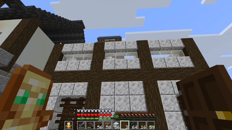 The second floor of the inn with white walls and shoji-style windows The second floor of the inn with white walls and shoji-style windows