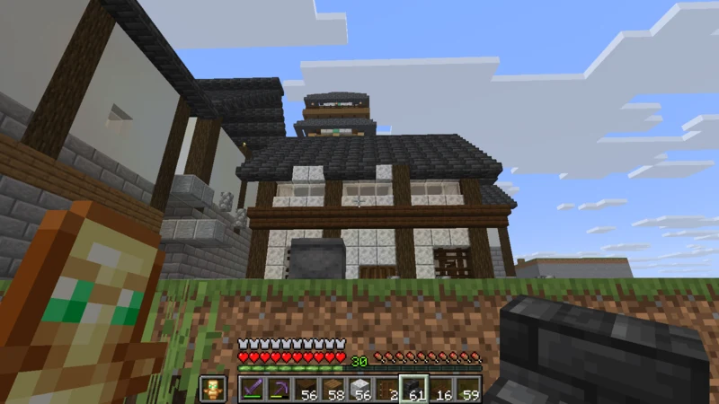 The completed front of the inn with a deep slate roof The completed front of the inn with a deep slate roof