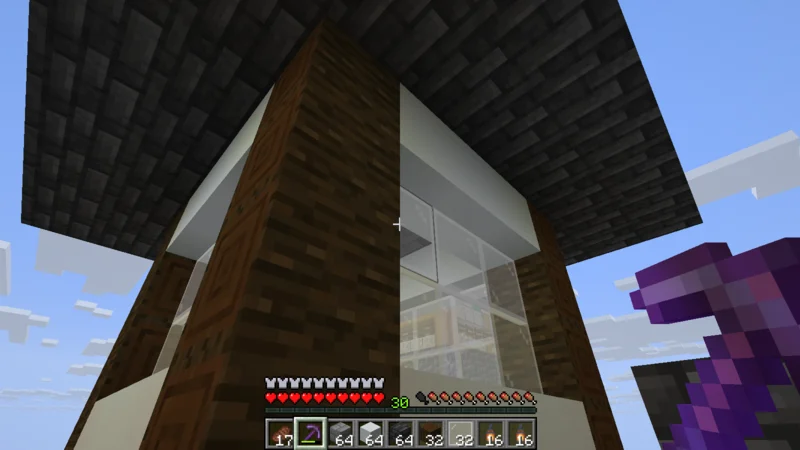 The third tier of the Inui Yagura with white walls, lattice windows, roof, and ridge The third tier of the Inui Yagura with white walls, lattice windows, roof, and ridge