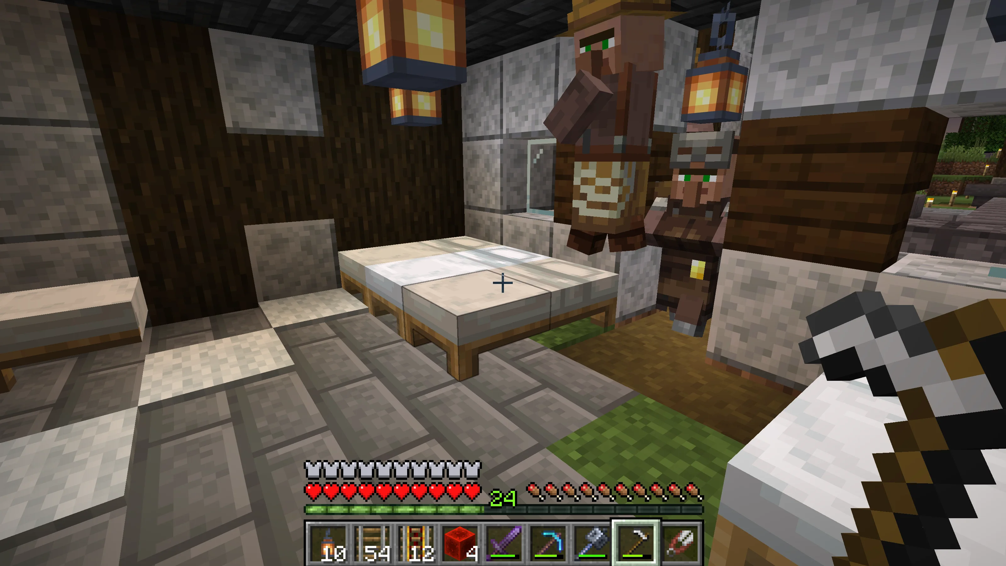 Villagers gathering beside beds in the lodging at night Villagers gathering beside beds in the lodging at night