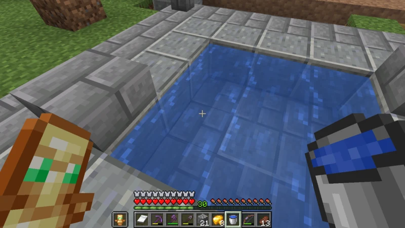 Filling a bucket from a stone-lined pool above ground Filling a bucket from a stone-lined pool above ground
