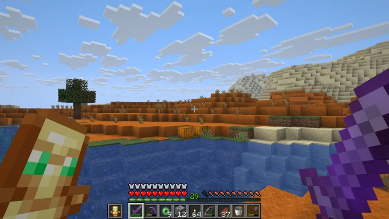 The red land of a Mesa beyond a river at dusk