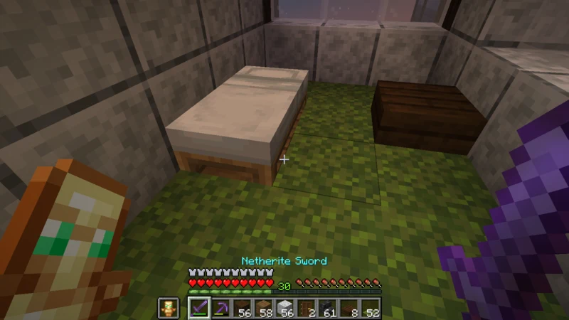 A white futon and small desk in an inn guest room A white futon and small desk in an inn guest room