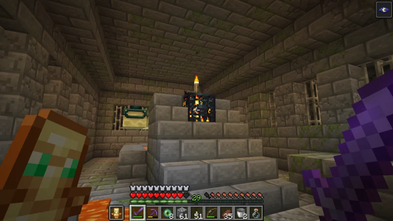 A silverfish spawner with a torch on it beside the portal frame