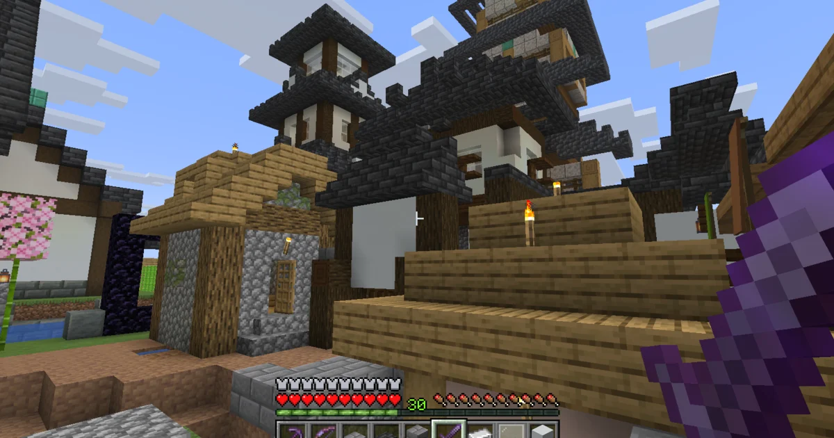 The completed main gate complex seen across the castle town, with the Inui Yagura and keep behind it