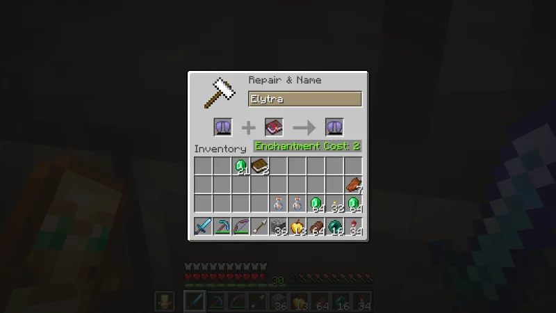 An Elytra and a Mending book placed together in an anvil screen An Elytra and a Mending book placed together in an anvil screen