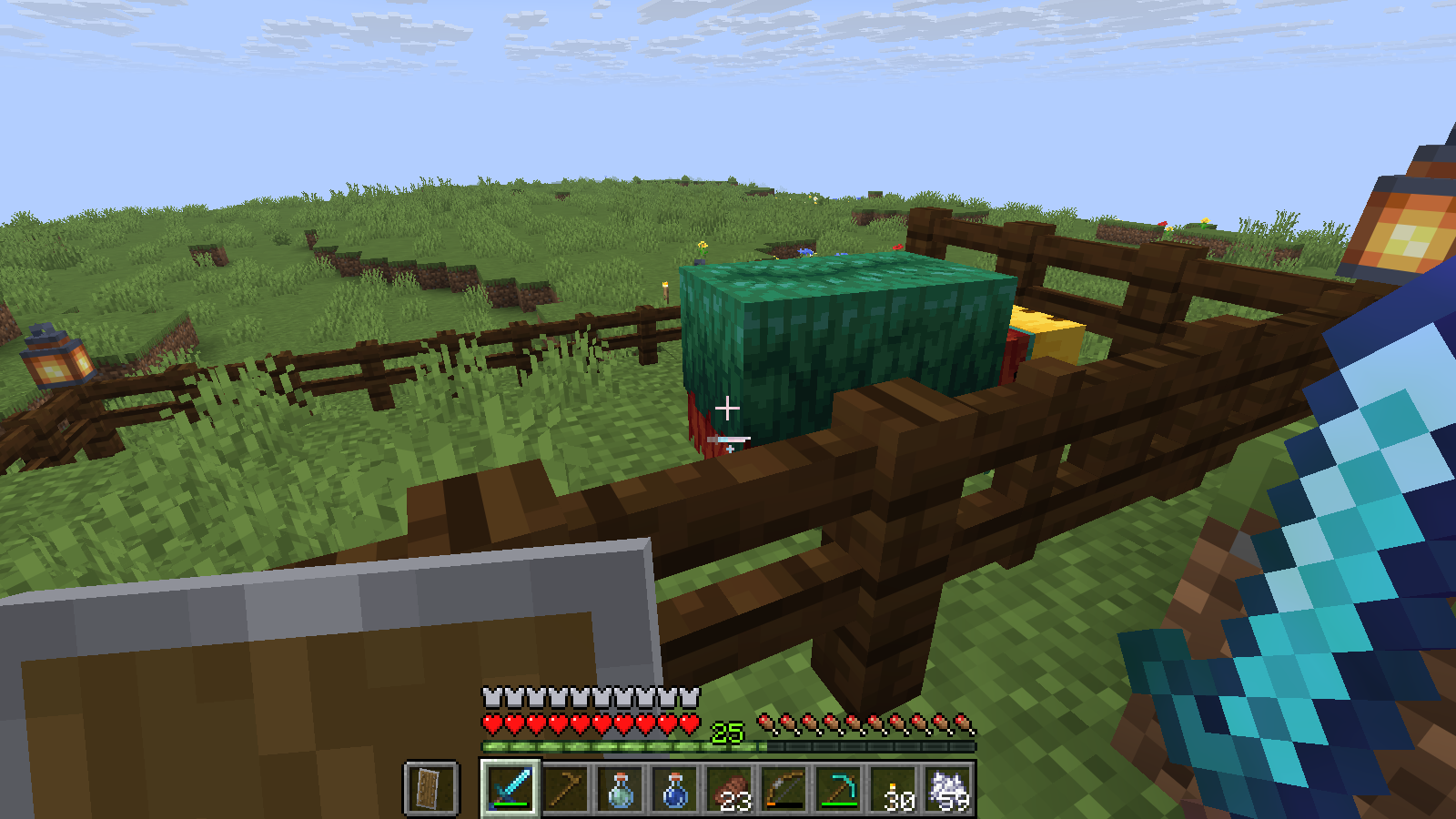 A baby Sniffer inside a fenced pen with grassland beyond A baby Sniffer inside a fenced pen with grassland beyond